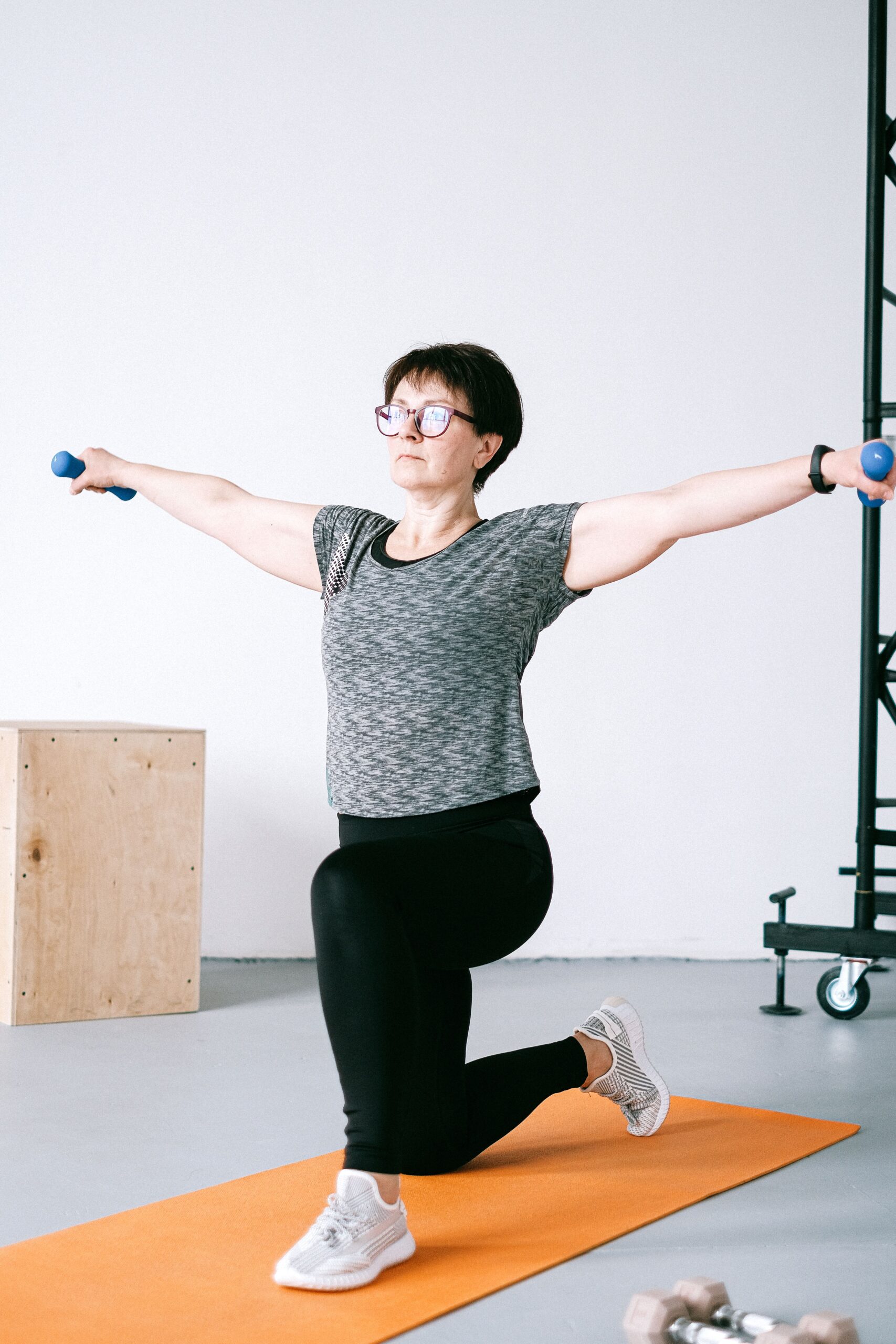A woman stretching as part of her prehabilitation program